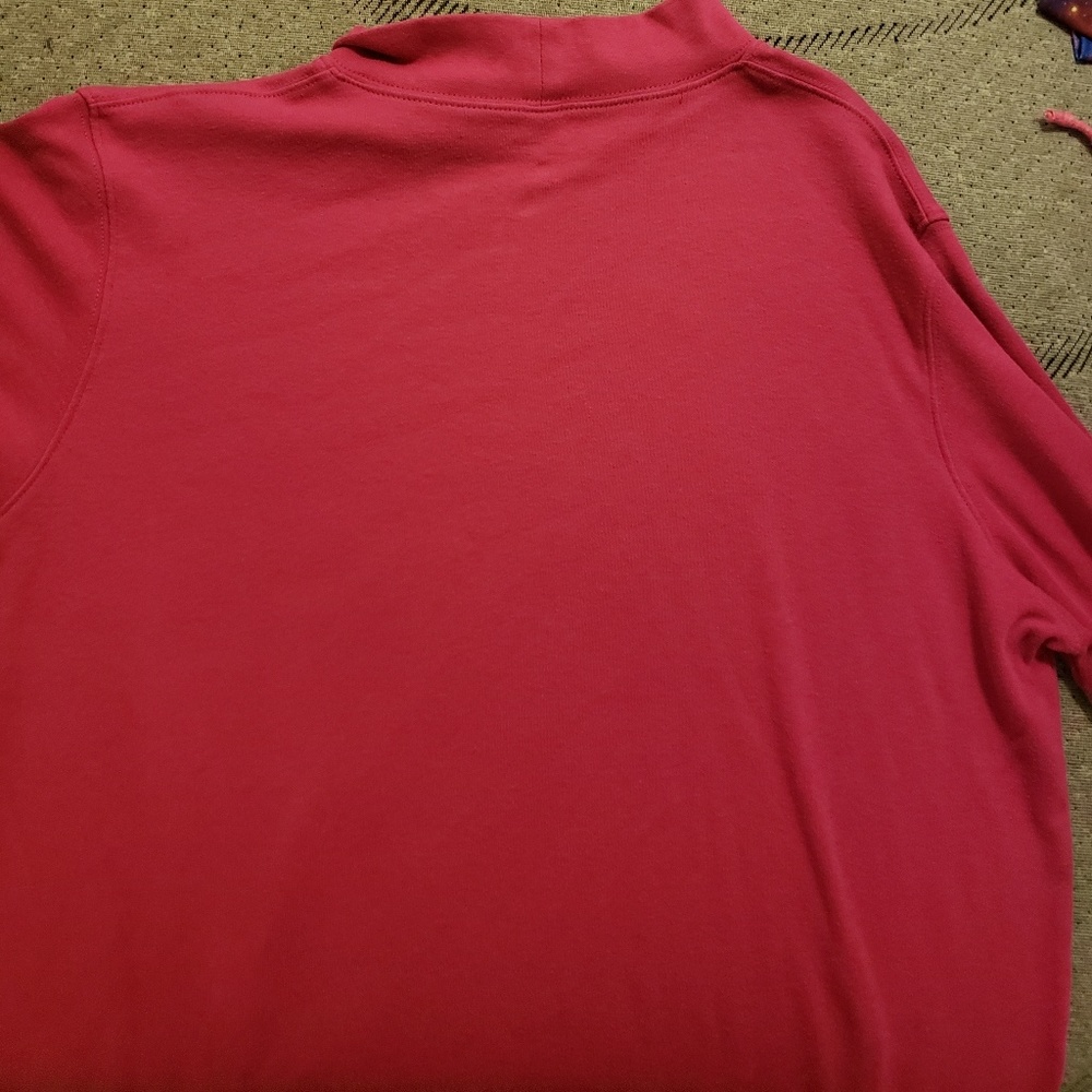 A pink turtleneck